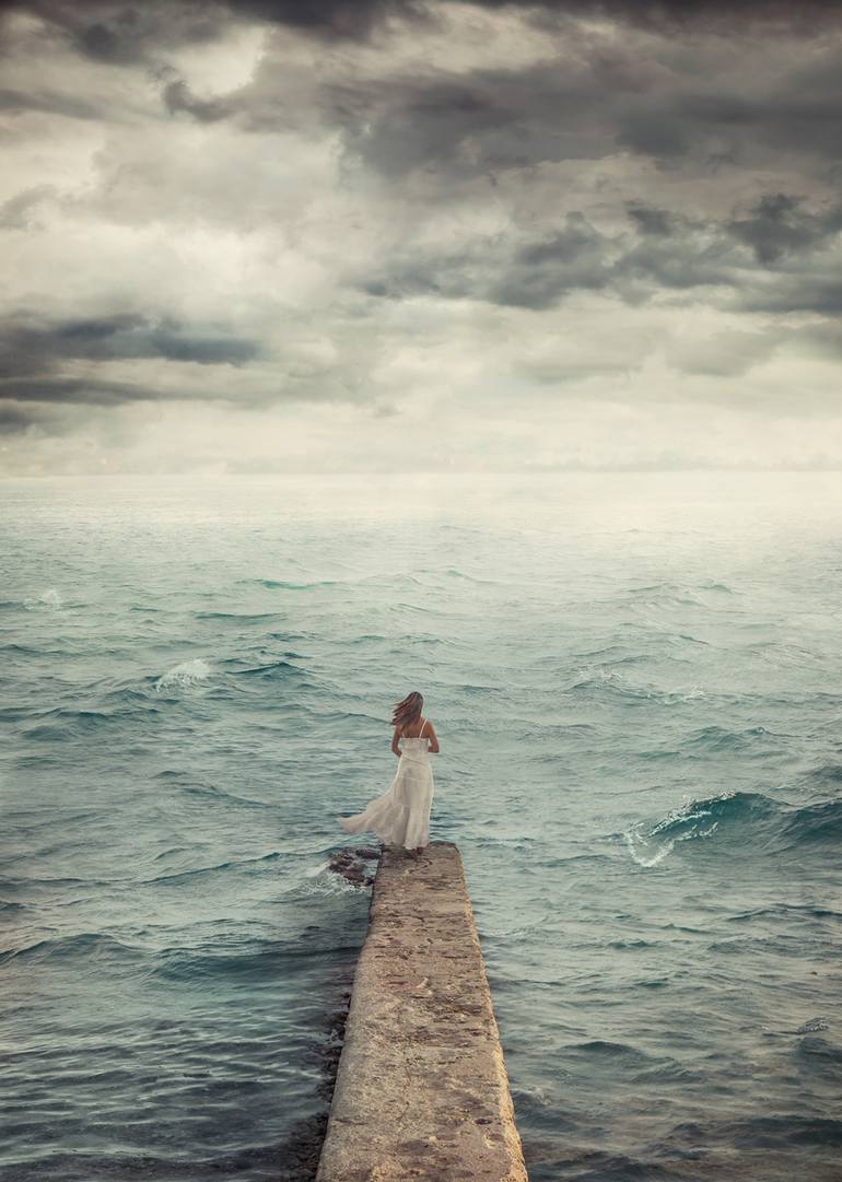 woman waiting near sea alone nikolina petolas